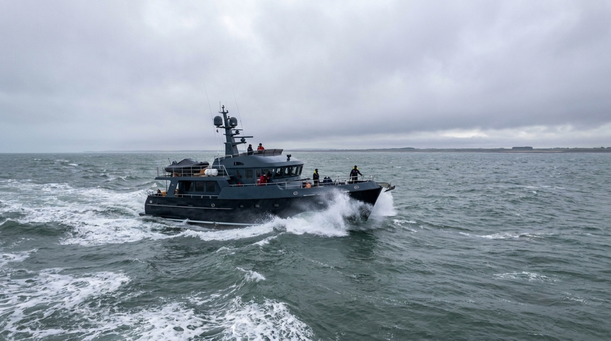 A motor yacht under way in grey northern European waters